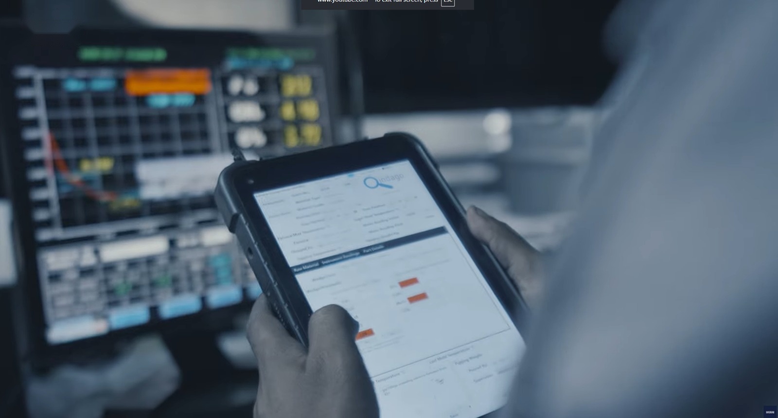 Engineer reviewing production data on the shop floor
